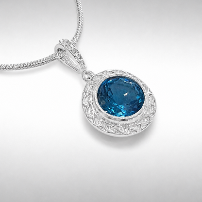 Swiss Blue Topaz Pendant with Halo Setting