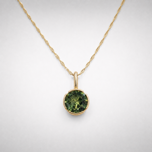 Peridot set in a 14K Gold Open Bezel